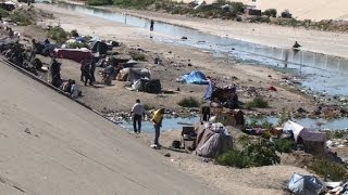 Cientos deportados viven en un desagüe de Tijuana [upl. by Tor755]