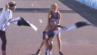 Stranger Carries Woman to Marathon Finish Line [upl. by Ehav418]