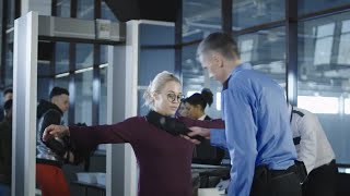 Airport Security Guard Checking Passenger Stock Video [upl. by Huppert333]