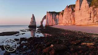 Falaises dEtretat à travers la Manneporte sunset  Drone 4K  FRANCE [upl. by Ahsinaj759]