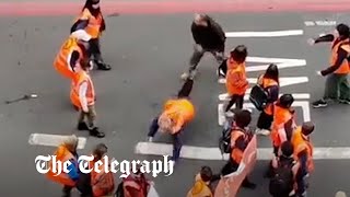 Just Stop Oil protester thrown to ground by enraged motorist [upl. by Grenville911]