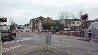 Two trains at Bedhampton level crossing Hampshire [upl. by Maureene]