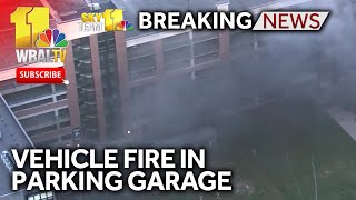 Crews extinguish vehicle fire in parking garage [upl. by Spillihp285]