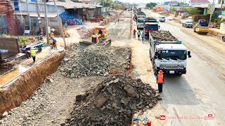 Powerful Many Dump Trucks dumping stones with Bulldozer spreading stones making road foundation [upl. by Verdie]