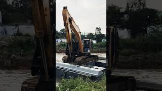 Preparation for handling Corrugated Concrete Sheet Piles using a pontoon excavator shorts [upl. by Acissehc440]