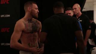 McGregor and Woodley Come Face to Face After Weigh Ins [upl. by Annayoj120]