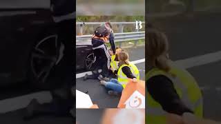 Irate Driver Drags Climate Protestors Blocking Road Out of His Way [upl. by Sessilu]