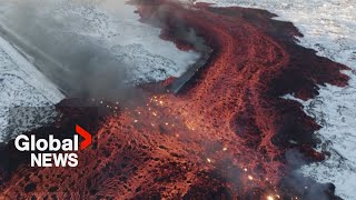 Iceland volcano Mesmerizing drone video shows bubbling lava swallow road near Blue Lagoon [upl. by Urson987]