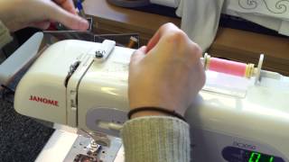 How to wind a bobbin and thread a Janome DC3050 sewing machine [upl. by Yokum]