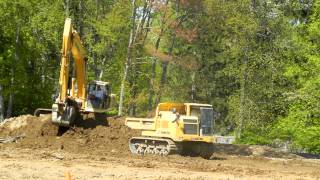 Komatsu PC300LC Loading a Komatsu CD110R Tracked Dump Truck [upl. by Jojo794]