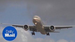 Incredible footage shows plane HOVERING in crosswind  Daily Mail [upl. by Enyawal455]