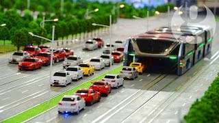 Bus that moves above traffic jams unveiled in China [upl. by Kcirred917]