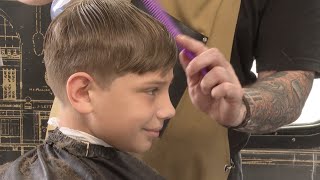 They feel really good about themselves Barber gives haircuts to local kids [upl. by Nedah676]