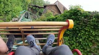 Gsengte Sau bobsled coaster at Tripsdrill in Germany Intertwined with building and logflume POV [upl. by Sgninnej304]