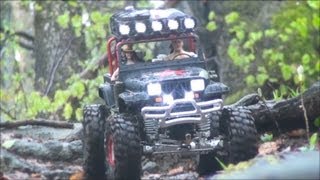 Tamiya CR01 Jeep Wrangler in a rainy stony Forest [upl. by Nnylidnarb]