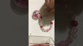 Opening my new Hello Kitty jewellery set that comes with a pouchlip balms on the necklacebracelet [upl. by Iturhs151]