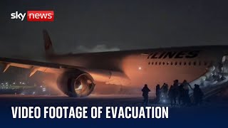 New footage of passengers evacuating burning plane in Japan [upl. by Oruasi]