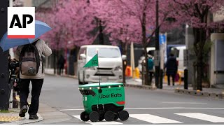 Uber Eats launches robot food delivery service in Tokyo [upl. by Sussi]