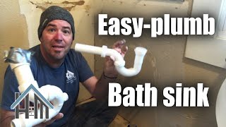 How to re plumb bath or kitchen sink reroute drain line Easy How to Home Repair [upl. by Auhesoj]