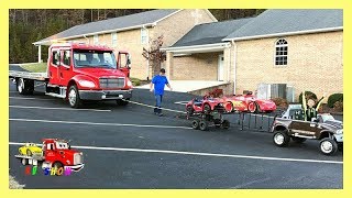 Towing The Rollback With His Powered Ride On Dodge Ram Two Car Trailer [upl. by Frodeen737]