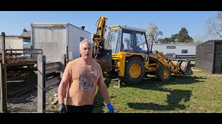 Chain harrowing with the help of JCB and Ford 4000 [upl. by Ekeiram281]