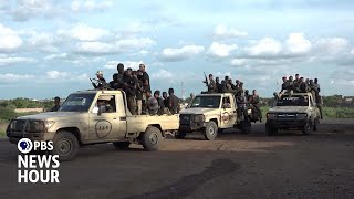 Sudanese teachers and shopkeepers join the fight against rebels in nations civil war [upl. by Htesil]