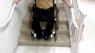 How To Climb Stairs in a Wheelchair Using Handrails [upl. by Sirroned658]