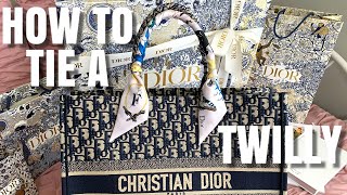 How to Tie A Dior Mitzah Scarf  Louis Vuitton Bandeau  Hermes Twilly on Dior Book Tote Bag Handle [upl. by Amliw83]