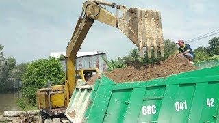 Xe Cuốc với xe Kamaz làm bờ kè đóng cừ tràm bờ sông  Cuộc sống quanh ta New [upl. by Hgielra979]