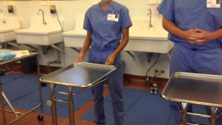 How to Aseptically Setup Surgical Gown and Gloves on Mayo Stand [upl. by Yreved]