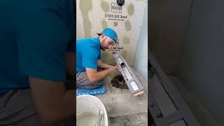 Schluter Shower System  Installing a Linear Channel Body [upl. by Ahsilef]