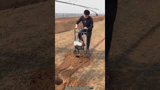 Drilling holes in the ground with a petrol drill [upl. by Esyak963]