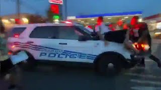 Protesters hit by police car as it drives through crowd in Detroit [upl. by Obe146]