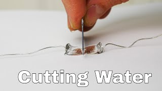 Superhydrophobic Knife Slices Water Drops in Half [upl. by Retsevlis]