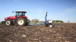 Versatile MFWD model 260 tractor pulling a Kinze 3200 planter [upl. by Beeson842]