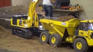 Komatsu PC 490 LC loads Bell B40D with sand [upl. by Ettezzil565]