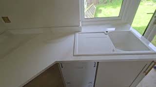 Calacatta Gold 30mm kitchen worktop with hob splashback and upstands was fitted in Walberton [upl. by Lallage]