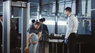 Airport Security Agent Frisking passenger Stock Video [upl. by Tnilk]