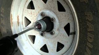 How to Grease Trailer Wheel Bearings with EZ Lube Grease Cert [upl. by Ahsinroc]