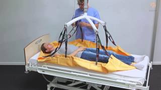 Guldmann Sling Instruction Repositioning Sling  Repositioning patient in bed with Crosshanger [upl. by Ylrebmit]