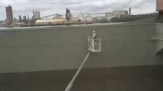 Ship crew collecting cement clinker dust from cargo hold [upl. by Ecirtam591]