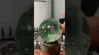 Dichroic glass marble can display multiple different colors depending on lighting conditions [upl. by Dymphia]