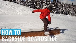 How To Backside Boardslide On A Snowboard [upl. by Ettigdirb]