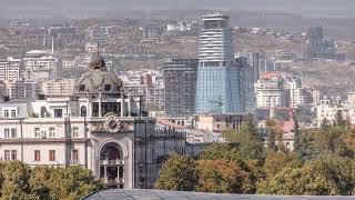 The glass tower of hotel in Tbilisi aerial timelapse skyscrapers of Georgia [upl. by Girovard]