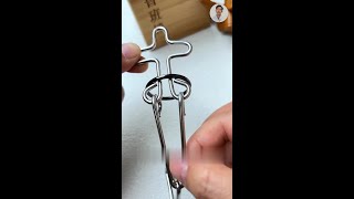 How to Remove Ring from Cross Shaped Wire Puzzle CrossWirePuzzle MetalBrainTeaser [upl. by Gazzo949]