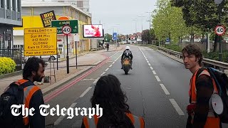 Moment motorcyclist rams past Just Stop Oil protesters blocking the road [upl. by Htaek]