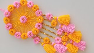 DIY Easy Woolen Flower wall hanging craft ideasWoolen wall hangingWoolen craftWoolen torantoran [upl. by Yann]