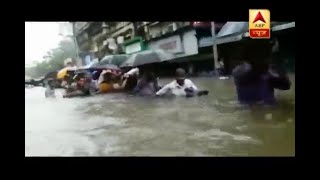 Mumbai Rains Watch how people are forced to travel by foot in chestdeep water [upl. by Alehc721]