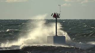 Waves Slam Against Lake Michigan Lighthouse [upl. by Llewsor]