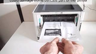 How to fix a printer paper jam [upl. by Crescantia]